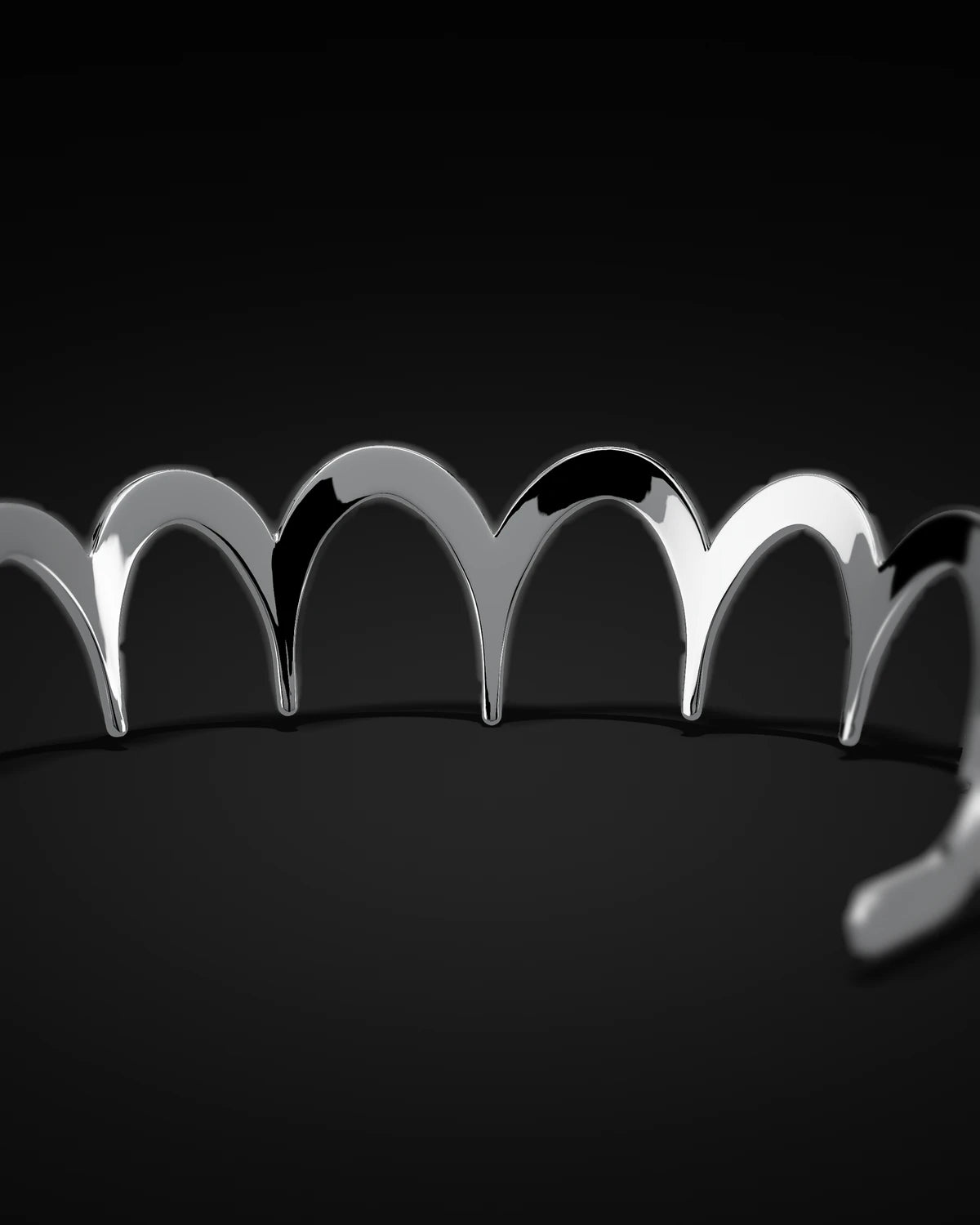 The Zig Zag Hairband seen low from the front, its arches running across the frame